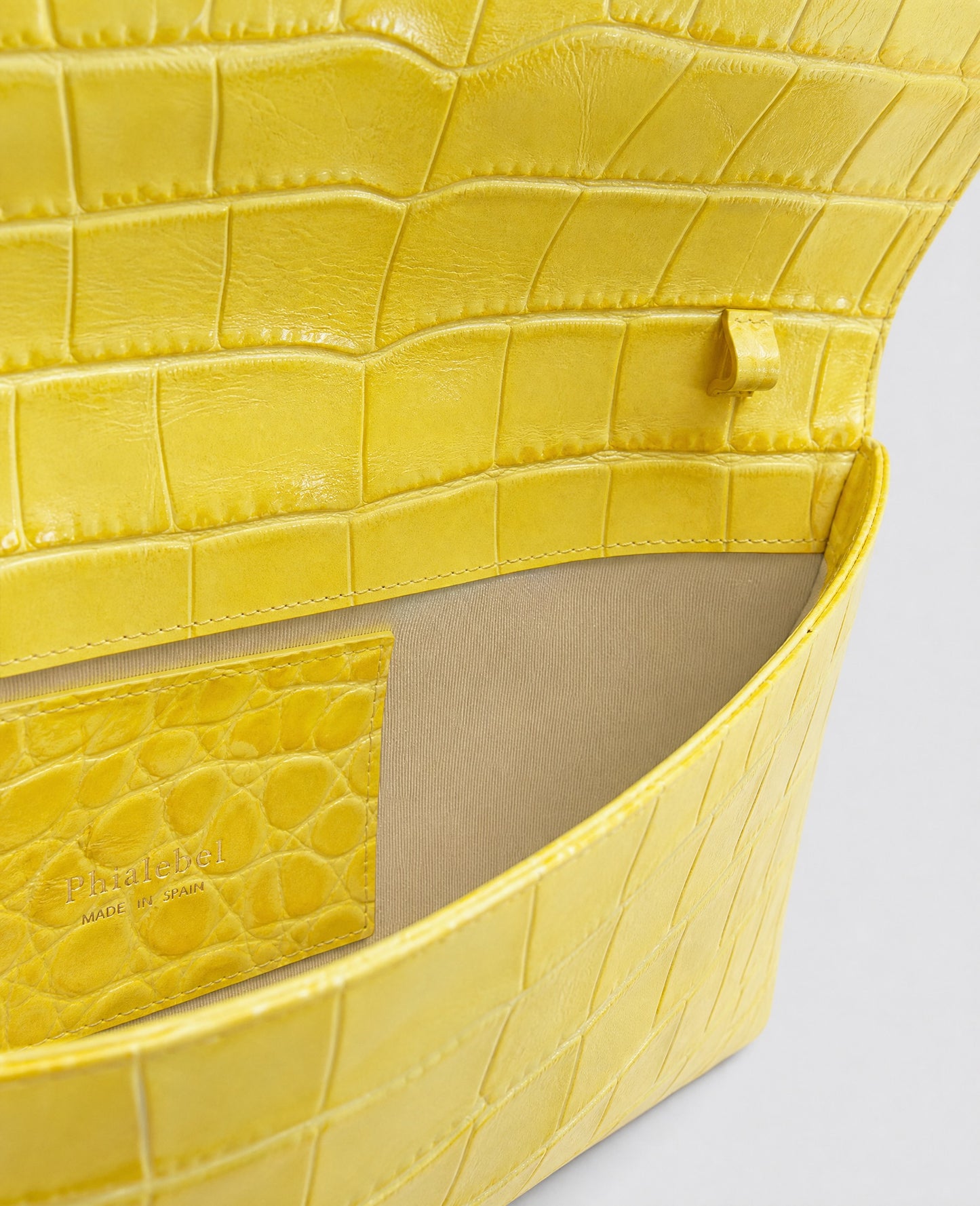 Clutch bag in black crocodile-embossed cowhide leather